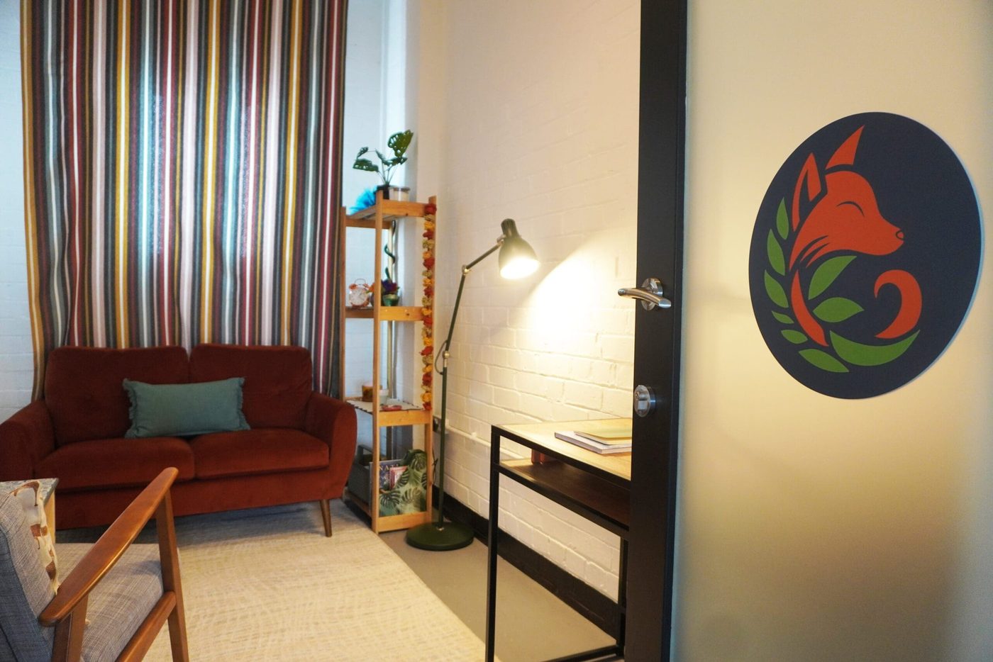 The Cosy Room, with soft seating and warm lighting